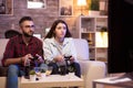 Beautiful young couple having fun playing video games Royalty Free Stock Photo