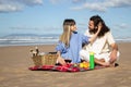 Beautiful young couple having picnic on the beach Royalty Free Stock Photo