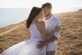 Beautiful young couple hugging in nature. People in white clothes Royalty Free Stock Photo