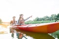 Beautiful young couple kayaking on lake Royalty Free Stock Photo