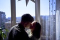 beautiful young couple kissing in the backlight against the window Royalty Free Stock Photo