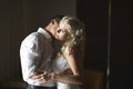 Beautiful young couple kissing with emotional embrace. Royalty Free Stock Photo