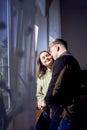 beautiful young couple kissing near the window Royalty Free Stock Photo