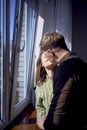beautiful young couple kissing near the window Royalty Free Stock Photo