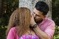 Beautiful young couple kissing in the park Royalty Free Stock Photo