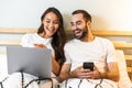 Beautiful young couple laying together in bed Royalty Free Stock Photo