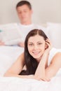 Beautiful young couple ling in bed. Royalty Free Stock Photo