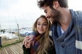 Beautiful young couple in love in a cold winter on the beach. Royalty Free Stock Photo