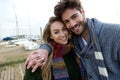 Beautiful young couple in love in a cold winter on the beach. Royalty Free Stock Photo