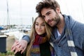 Beautiful young couple in love in a cold winter on the beach. Royalty Free Stock Photo