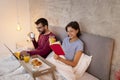 Couple eating breakfast in bed Royalty Free Stock Photo