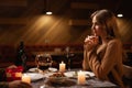 Beautiful young couple in love having a romantic candlelight dinner at home Royalty Free Stock Photo