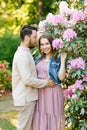 Beautiful young couple in love husband and wife hug each other, enjoying the spring summer day, walking in the Park Royalty Free Stock Photo