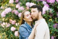 Beautiful young couple in love husband and wife hug each other, enjoying the spring summer day, walking in the Park. Happy and har Royalty Free Stock Photo