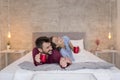 Couple drinking morning coffee in bed Royalty Free Stock Photo