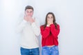 Beautiful young couple over white isolated background shocked covering mouth with hands for mistake Royalty Free Stock Photo