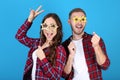 Young couple with paper booth props