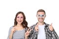 Young couple with paper booth props