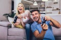 Young couple playing video games at home Royalty Free Stock Photo