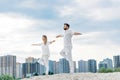 beautiful young couple practicing yoga in tree pose Royalty Free Stock Photo