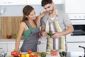 Beautiful young couple preparing healthy meal together