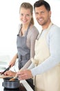 beautiful young couple preparing healthy meal together Royalty Free Stock Photo