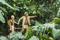 beautiful young couple in safari suits holding hands and hiking