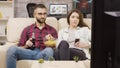 Beautiful young couple sitting on the couch Royalty Free Stock Photo