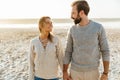 Beautiful young couple standing at the sunny beach Royalty Free Stock Photo