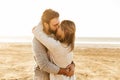 Beautiful young couple standing at the sunny beach Royalty Free Stock Photo