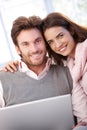 Beautiful young couple using laptop smiling Royalty Free Stock Photo