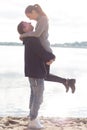 Beautiful young couple walking along the beach on a sunny spring day autumn Royalty Free Stock Photo