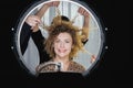 Beautiful young curly woman having fun in beauty salon Royalty Free Stock Photo