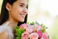 A beautiful young cute black long hair Asian woman holding a sweet color roses bouquet  with happy and deep love emotion Royalty Free Stock Photo