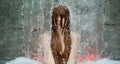 beautiful young cute sexy Portrait of a redhead woman under the splashing pattering waterfall, burbling water in the spa wellness