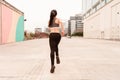Beautiful Young dark haired athlete woman doing sprint sprinting outdoors. Concept of full life, natural and healthy life. Women` Royalty Free Stock Photo