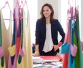 Beautiful young designer in her fashion atelier showroom.