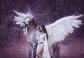 Beautiful, young elf, walking with a unicorn. She is wearing an incredible light, white dress. Art hotography