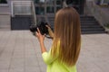 Beautiful young estate agent taking photos of new apartment.