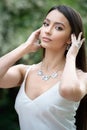 Beautiful young european woman with elegant earrings and necklace