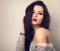 Beautiful young expressive make-up model with red lipstick and l