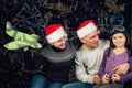 A beautiful young family dreams of a Christmas trip