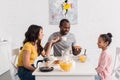 beautiful young family having breakfast Royalty Free Stock Photo