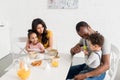 beautiful young family having breakfast together Royalty Free Stock Photo