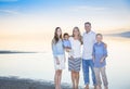 Beautiful Young family portrait on the beach Royalty Free Stock Photo