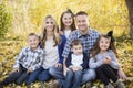 Beautiful Young Family Portrait with fall colors in the background Royalty Free Stock Photo