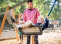 Beautiful young family with small son playing on playground in autumn. Royalty Free Stock Photo