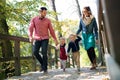 Beautiful young family with small twins on a walk in autumn forest. Royalty Free Stock Photo