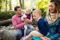 Beautiful young family with small twins on a walk in autumn forest. Royalty Free Stock Photo