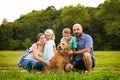Beautiful young family with their pet dog Royalty Free Stock Photo